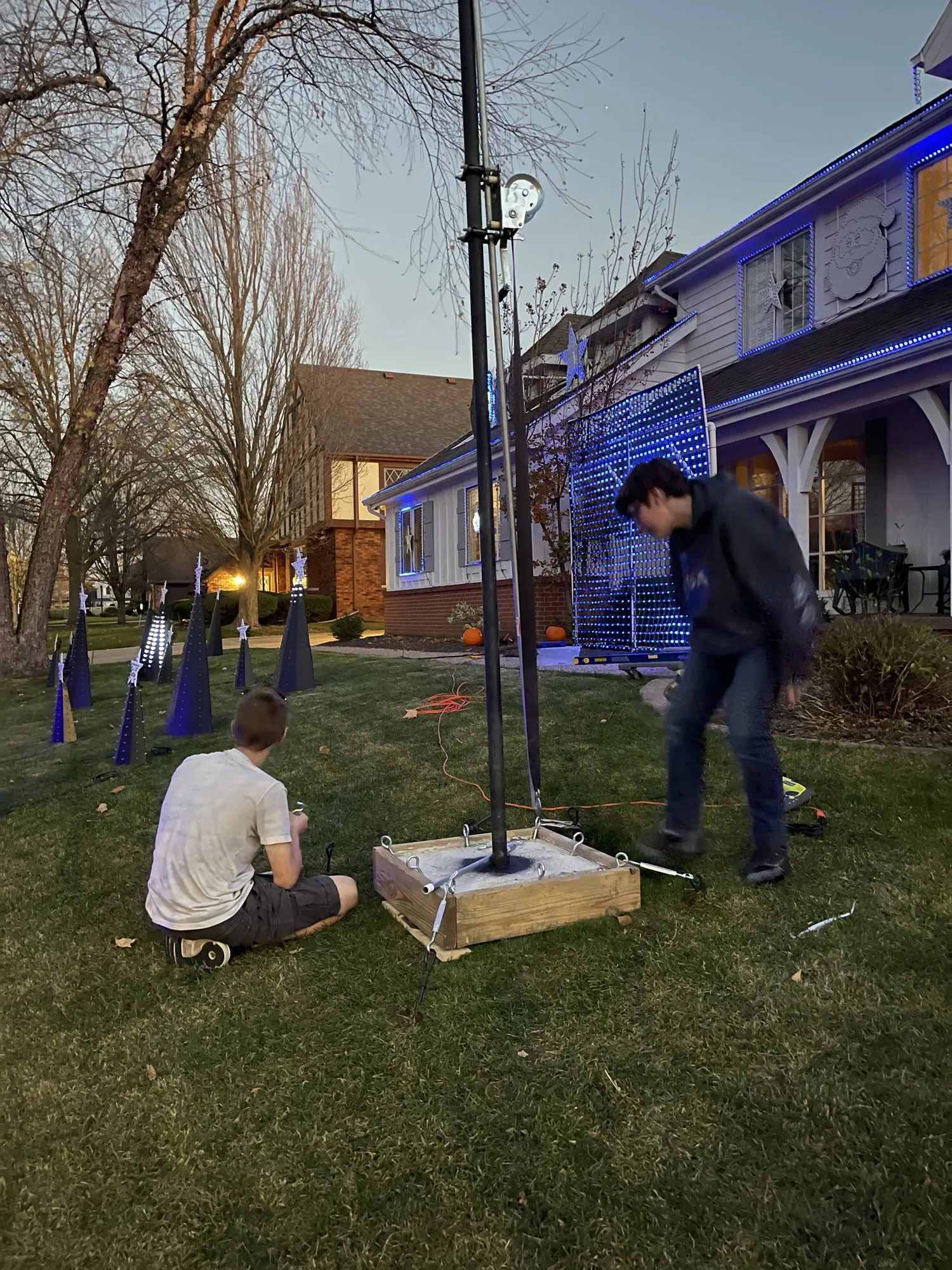 Max and Will raising the mega tree pole, 2022